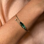 18k yellow gold bracelet with green tourmaline and a bezel set diamond by Fringe Gallery studio jeweler Sandra Frias