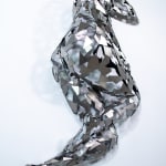 Stainless steel sculpture of a person laying on their side with their arm under their head by slate gray gallery artist David Davis
