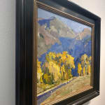 Oil on linen painting in a frame of mountains and yellow trees by slate gray gallery artist Julee Hutchison