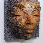 "Mask #178" a sculpture of a face made from wooden sticks and paint by slate gray gallery artist Gil Bruvel