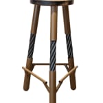 Stool with a brown seat and legs made of ski cables by slate gray gallery artist Aspekt Designs