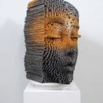 "Mind Bending" a sculpture of a face made from wooden sticks and paint by slate gray gallery artist Gil Bruvel