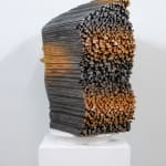 "Mind Bending" a sculpture of a face made from wooden sticks and paint by slate gray gallery artist Gil Bruvel