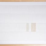 White and tan thread on paper work by Fringe Gallery artist Rebecca Messier