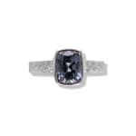 Grey spinel stone in platinum band with diamonds by studio jeweler Barbara Heinrich (front view)