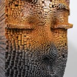 "Mind Bending" a sculpture of a face made from wooden sticks and paint by slate gray gallery artist Gil Bruvel
