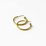 Yellow gold skinny hoops by Fringe Gallery studio jeweler Nanci Modica