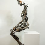 Stainless steel sculpture of a person sitting upright by slate gray gallery artist David Davis
