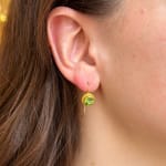 Round faceted green tourmaline and yellow gold earrings by Fringe Gallery studio jeweler Nanci Modica