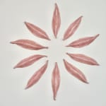 Pink Ceramic petals that can be arranged in multiple ways by slate gray gallery artist Angela Okajima-Kempinas