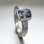 Grey spinel stone in platinum band with diamonds by studio jeweler Barbara Heinrich (side view)