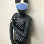 Clay with chalkboard paint ceramic sculpture of an alien looking creature with a swirl on its chest by slate gray gallery artist Julie McNair
