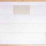 White and tan thread on paper work by Fringe Gallery artist Rebecca Messier