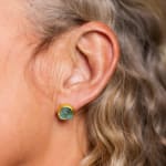 22k and 18k yellow gold stud earrings with bezel set rough aquamarine by Fringe Gallery studio jeweler Petra Class.