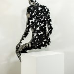 Stainless steel sculpture of a person sitting upright by slate gray gallery artist David Davis