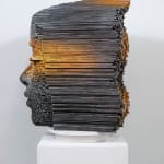 "Mind Bending" a sculpture of a face made from wooden sticks and paint by slate gray gallery artist Gil Bruvel