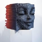 "Sphinx" a sculpture of a face made from wooden sticks and paint by slate gray gallery artist Gil Bruvel