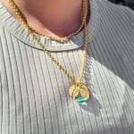 Yellow gold oval pendant with diamonds by Fringe Gallery studio jeweler Nanci Modica