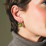 Hand cut faceted chunks of Lemon Citrine prong set in 18k prongs and hanging from 18k ear wires by Fringe Gallery studio jeweler Elizabeth Garvin