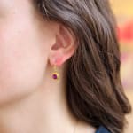 Yellow gold, grape garnet, and diamond earrings by Fringe Gallery studio jeweler Nanci Modica