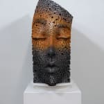 "Mind Bending" a sculpture of a face made from wooden sticks and paint by slate gray gallery artist Gil Bruvel