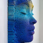 "Mask #96" a sculpture of a face made from wooden sticks and paint by slate gray gallery artist Gil Bruvel