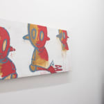 painting by Chris RWK of three red and gold robots hanging on a white gallery wall with a small window and sculpture to its right