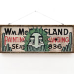 GATS character painted on a wooden sign with black and red writing