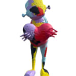 front view of a multi-colored robot statue holding a heart