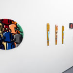 white gallery wall with a mixture of pieces by Chris RWK including a colorful rug and MTA paddles