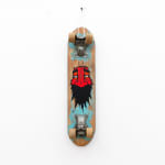 Vintage wooden skateboard with GATS character with a red face and big black beard painted on the bottom of it