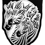 embroidered black and white banner of three zebra