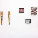 white gallery wall with a mixture of colorful pieces by Chris RWK