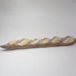Stephen Morrison "Baguette" ceramic sculpture of realistic baguette with human eyes and nose