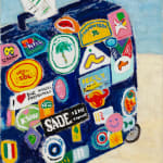 dark blue suitcase covered in travel stickers