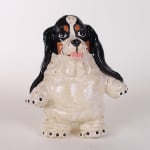 Katie Kimmel - ceramic sculpture of a black and white basset hound standing on its hind legs