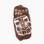Flattened and rusted spray can with GATS character painted in white
