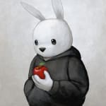 white rabbit in a black hoodie holding a red apple against white background