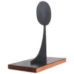 Scott Albrecht steel sculpture of circle balanced on top of angled piece side view