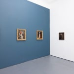 Install photo of Alison Friend's paintings hanging on a blue and white wall