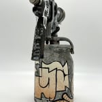 metal spray paint can decorated with GATS figure