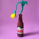Allison Baker's sculpture of a yellow flower in a beer bottle