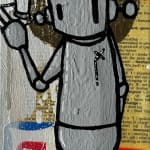 silver robot standing straight up with spray paint can