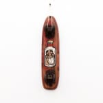 Brown wooden vintage skateboard with GATS character in a glass jar painted on the bottom of it