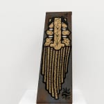 Metal shelf with GATS character painted on the sides and a metal chain painted on the back