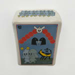 Ceramic sculpture of a card with two crow heads, two dogs with horns with stars, a white rabbit head and a black horse.