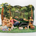 Scenic sculpture of a group of people sitting in a park under palm trees eating in n out on the grass.
