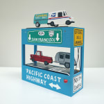 side-view of diorama-like sculpture featuring various vehicles and CA road signs by We Are Out of Office