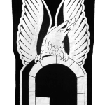 embroidered black and white banner of an eagle over a doorway
