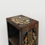 Metal shelf with GATS character painted on the sides and a metal chain painted on the back
